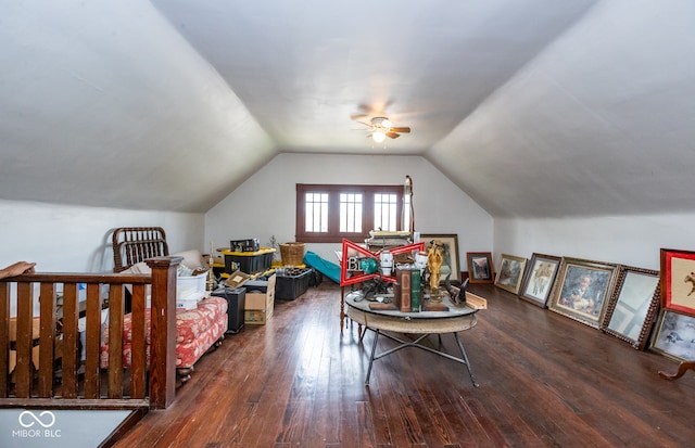 interior space with vaulted ceiling, dark hardwood / wood-style flooring, and ceiling fan