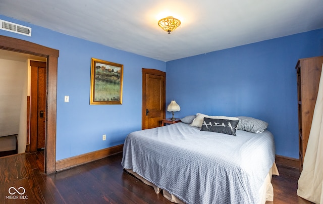 bedroom featuring dark hardwood / wood-style floors