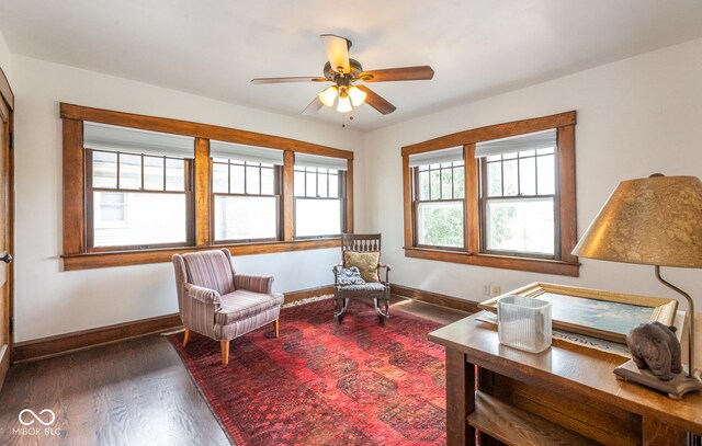 1457 Fairfield Ave, Indianapolis, IN 46205 - living area featuring wood finished floors, a ceiling fan, and baseboards
