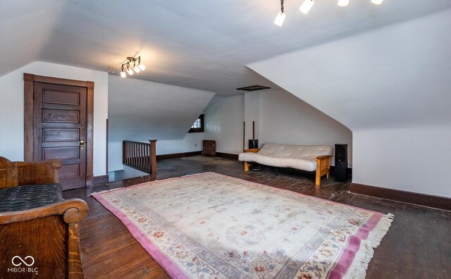1457 Fairfield Ave, Indianapolis, IN 46205 - bedroom featuring lofted ceiling, wood finished floors, and baseboards