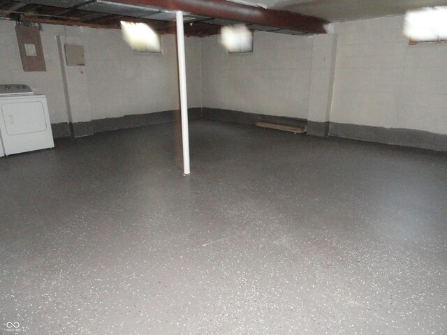 basement featuring washer / clothes dryer and electric panel