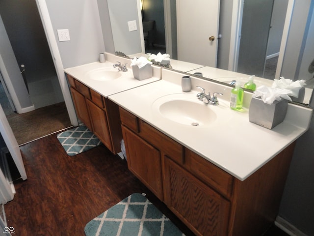 bathroom with vanity and hardwood / wood-style flooring