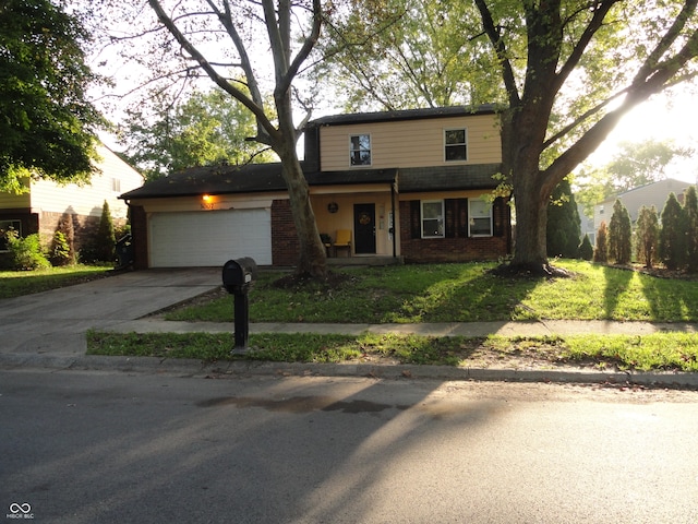 view of front property with a front lawn and a garage