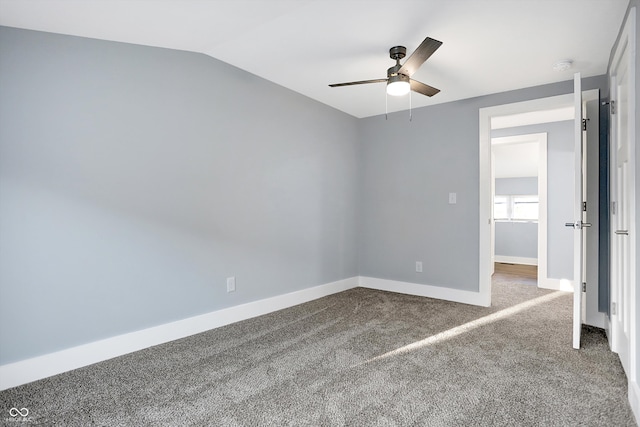 unfurnished room featuring lofted ceiling, carpet, and ceiling fan