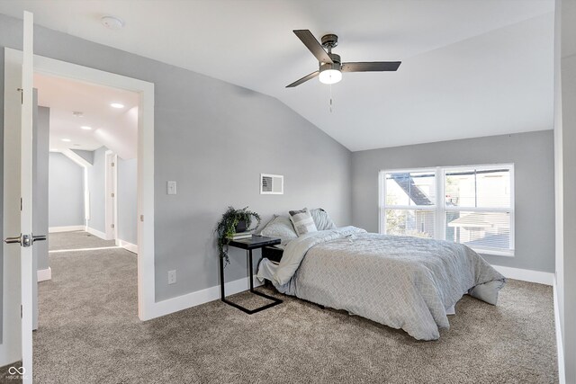 bedroom with light carpet, ceiling fan, and vaulted ceiling