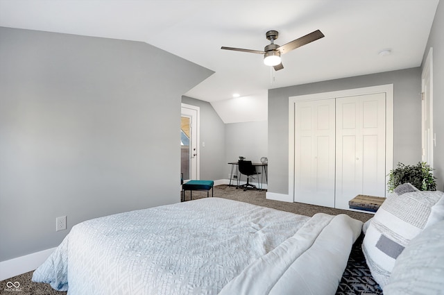 carpeted bedroom featuring lofted ceiling, a closet, and ceiling fan