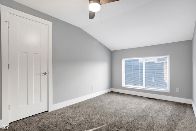 interior space featuring lofted ceiling, carpet floors, and ceiling fan