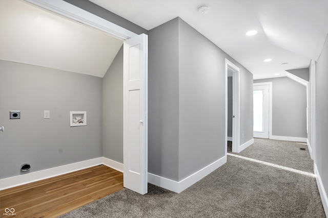 interior space featuring hardwood / wood-style floors and vaulted ceiling