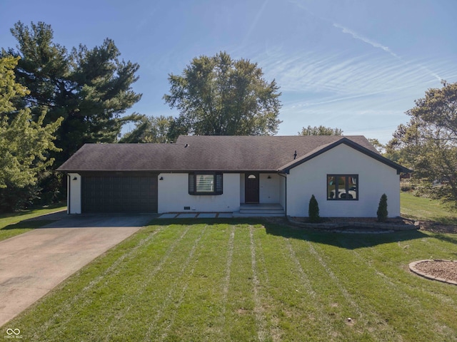 ranch-style home featuring a garage and a front lawn