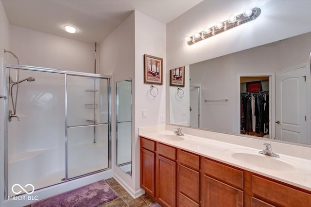 bathroom with vanity and an enclosed shower