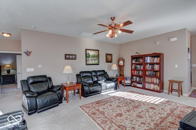 carpeted living room featuring ceiling fan