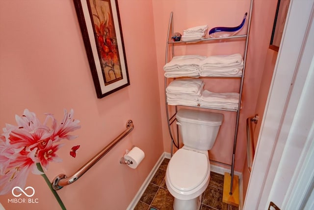 bathroom featuring tile patterned flooring and toilet