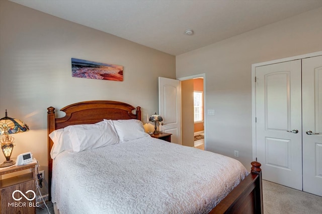 bedroom with light carpet and a closet