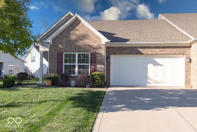 view of front of property featuring a garage and a front yard