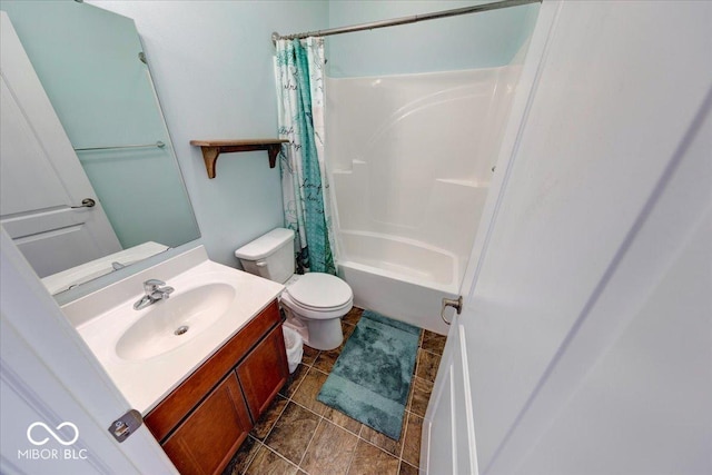 bathroom with toilet, vanity, and shower / bathtub combination with curtain