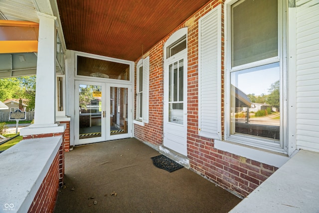 view of patio with french doors and a porch