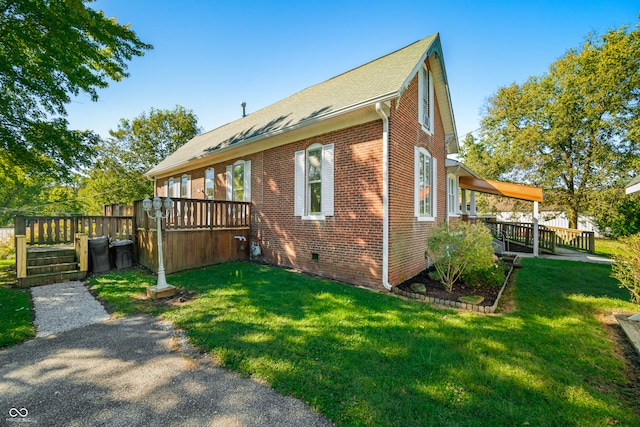 view of home's exterior with a yard and a wooden deck