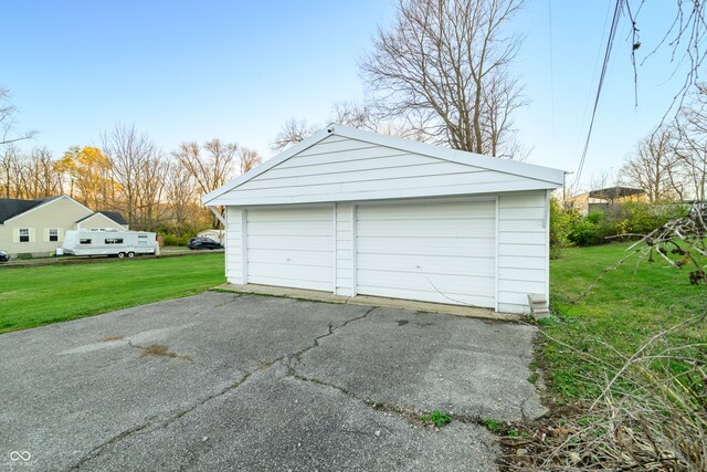 garage featuring a yard