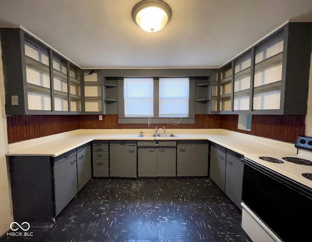 kitchen featuring white appliances, gray cabinets, and sink