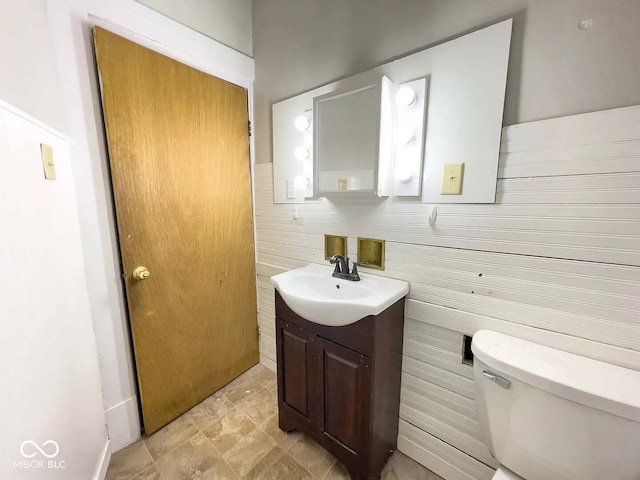 bathroom with toilet and vanity