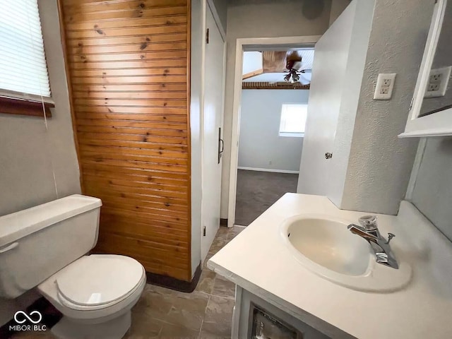 bathroom with ceiling fan, vanity, and toilet