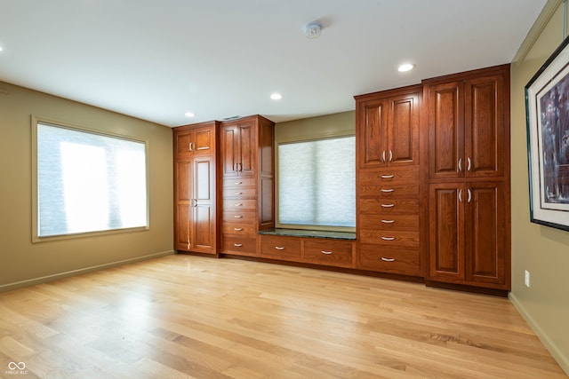 unfurnished bedroom featuring light wood-type flooring