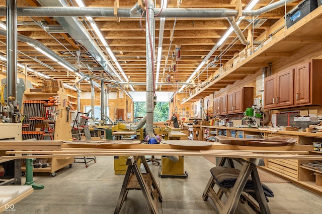 interior space with a workshop area and concrete flooring