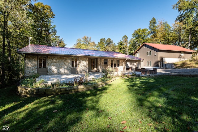 rear view of property featuring a yard and a patio