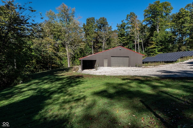 garage featuring a yard