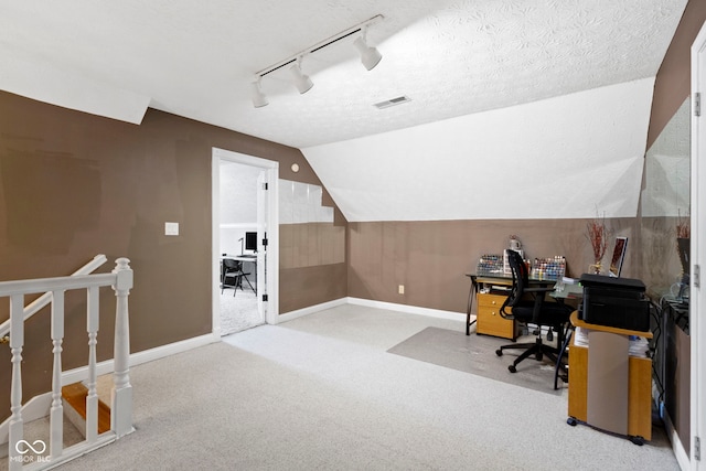 603 Ophelia Dr, Avon, IN 46123 - home office with rail lighting, carpet flooring, baseboards, and lofted ceiling