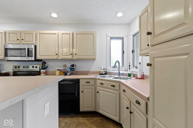603 Ophelia Dr, Avon, IN 46123 - kitchen featuring appliances with stainless steel finishes, a sink, light countertops, and recessed lighting
