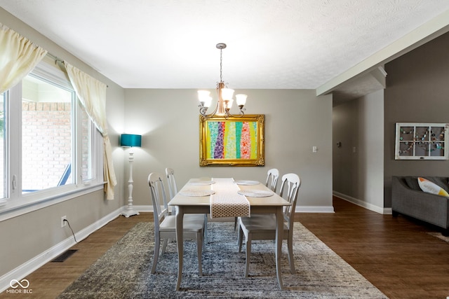 603 Ophelia Dr, Avon, IN 46123 - dining room featuring wood finished floors, a chandelier, and baseboards
