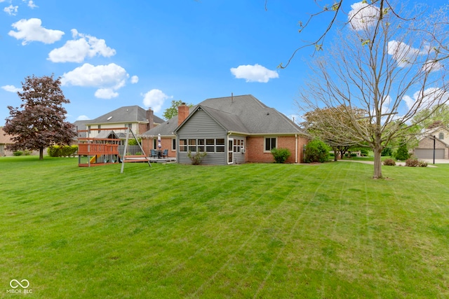 603 Ophelia Dr, Avon, IN 46123 - back of property with a deck, a lawn, and a sunroom