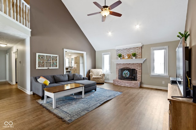603 Ophelia Dr, Avon, IN 46123 - living room with high vaulted ceiling, a ceiling fan, wood finished floors, and baseboards
