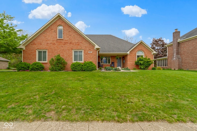 603 Ophelia Dr, Avon, IN 46123 - traditional-style house with brick siding and a front lawn
