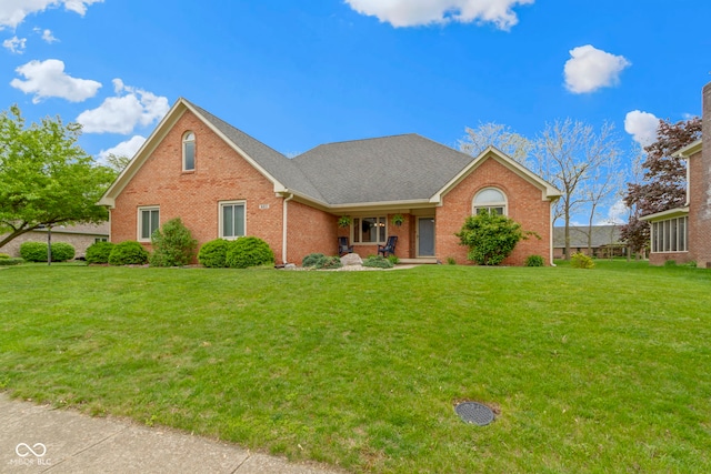 603 Ophelia Dr, Avon, IN 46123 - view of front of property with brick siding, a front yard, and covered porch