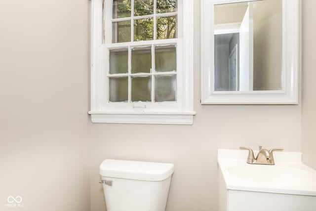 bathroom featuring vanity and toilet