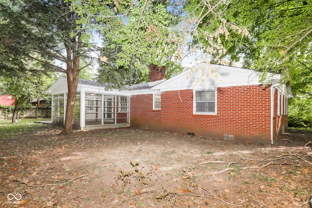 rear view of house with a sunroom