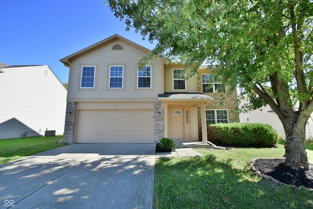 view of front of home featuring a garage and a front lawn