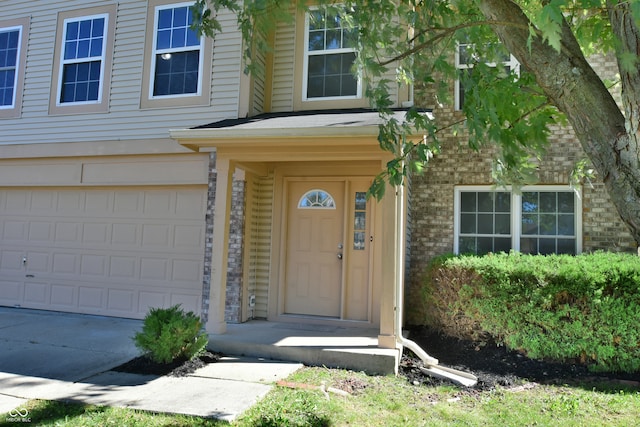 doorway to property featuring a garage