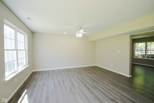 empty room with ceiling fan and wood-type flooring