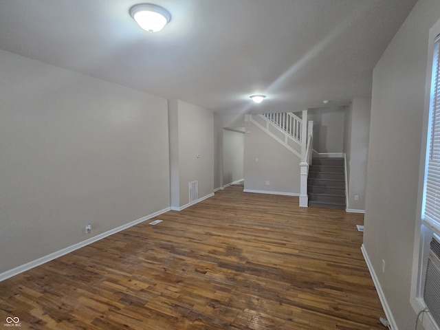 basement featuring dark hardwood / wood-style flooring