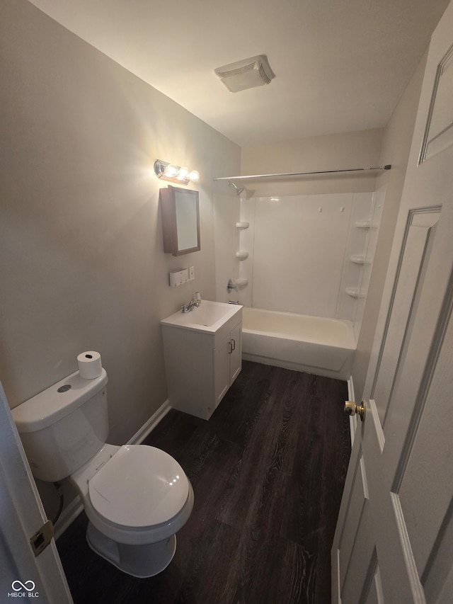 full bathroom with tub / shower combination, vanity, toilet, and wood-type flooring