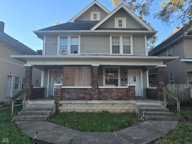 view of front facade featuring cooling unit and covered porch