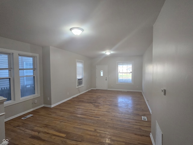 empty room with dark hardwood / wood-style floors