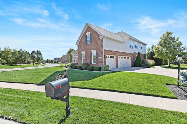 view of front of home with a garage and a front lawn