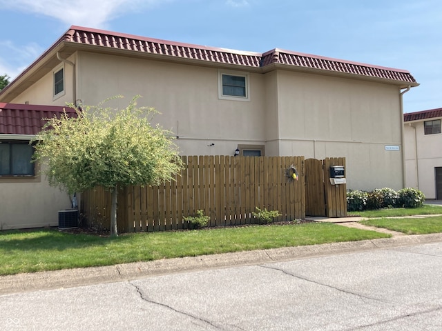 view of property exterior with central AC