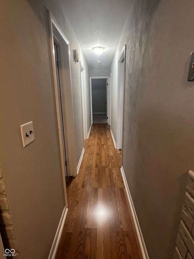 corridor featuring light hardwood / wood-style floors