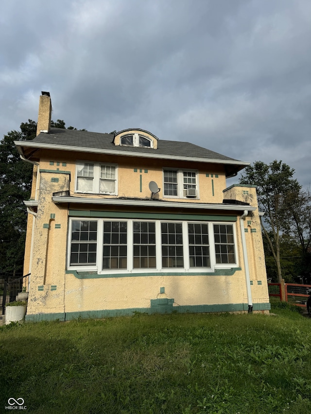 view of home's exterior with a yard