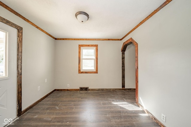 2682 E 150 S, Anderson, IN 46017 - unfurnished room with crown molding, wood finished floors, and arched walkways